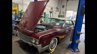 Checking the undercarriage of a nice '66 Lincoln Continental