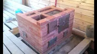 Отопительно варочная печь с духовым шкафом.