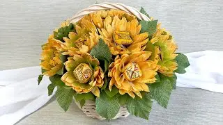 Bouquet of sweets Basket with sunflowers. Summer gift idea at home.