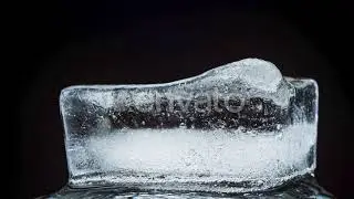 Ice Melts and Rotates on a Black Background | Stock Footage - Envato elements