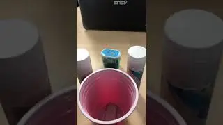 Two idiots spend too much time getting a ping pong ball into a cup