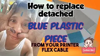 Blue Piece of plastic from  printer flex cable detached