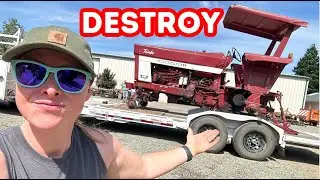 DESTROYING an old and beautiful tractor!