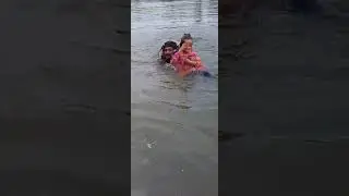 Little Angel trying to learn Swimming in Flood water