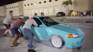 Front wheel drive car showing off at a drift meet