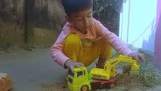 Baby Boy  Playing In Sand With A toys