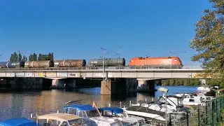 ÖBB Taurus fährt mit einem Kesselzug über die Spindlersfelder Brücke