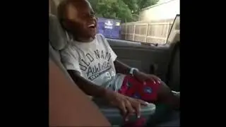 Black Kid Laughing in car meme