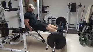 Barbell Leg Extensions for Quadricep Isolation in a Home Gym