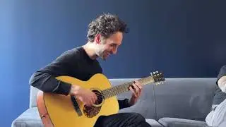 Julian Lage tests a new Collings Hill Country OM1 A HC at the shop