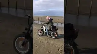 Embrace the freedom of riding the e-bike by the seaside