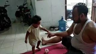Baby playing ball