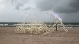 Strandbeests holding each other.