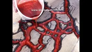 Pouring red epoxy resin fractal rivers on Walnut live edge board