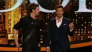 Ryan Seacrest tells Phillip Philips that Julianne Hough sighed and blushed and said 'yummy'