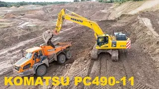 Komatsu PC490LC-11 loading dumpers in a quarry