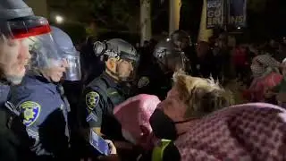 UCLA Police snatch one of the organizers of the protest outside Dodd Hall.