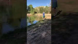 Little Man Fly Fishing Shallow Pond. 