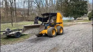 Spreading gravel with skid steer