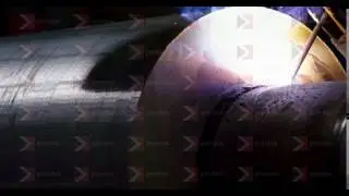 A welder is welding two metal parts