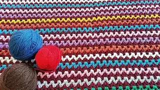 A gorgeous crochet blanket made from leftover yarn.