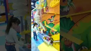 Karina plays with balls on the playground