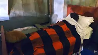 WE FIND PEOPLE LYING ON A BED INSIDE AN ABANDONED VILLA. WHAT ARE THEY DOING?