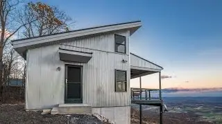 Mountaintop Cabin with an Amazing View and a Black Metal Roof - A.B. Martin