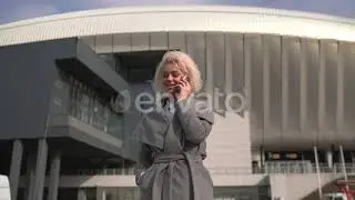 Woman answering her mobile phone | Stock Footage - Envato elements
