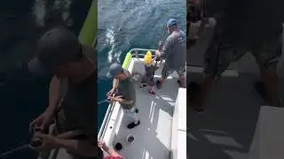 Kid catching his first fish aboard the Lois Ann Driftfishing Boat Fort Lauderdale 954-761-8045