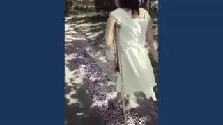 Beautiful amputee on one crutch