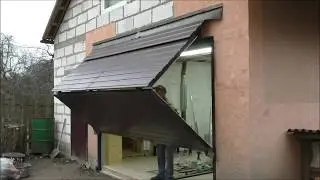 Подъемно-складные ворота в гараже (мастерской)
