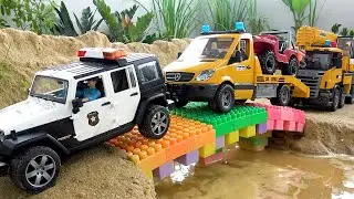 Police car and LEGO toy bridge