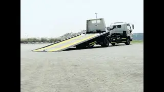 Tilt and Slide Recovery/Tow Truck On Hino Truck Manufactured by PM Truck (Precision Machinery LLC)