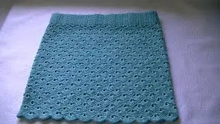 Knitting an openwork crochet summer skirt.