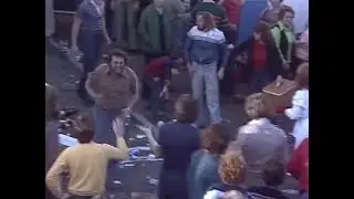 A woman belts a bloke with her handbag at the 1978 VFA GF