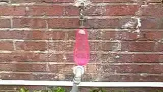 Water balloon bursting in slow motion