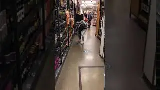Guy using mini shopping cart.