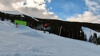 Snowboarding jump and grab, happy park day!