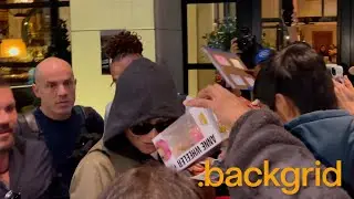 Zendaya signs for fans before catching a flight out of New York, NY