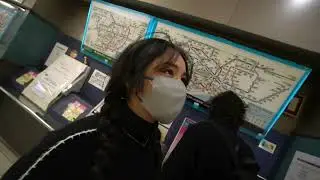 Rae tries to insert US dollars into a Japanese machine
