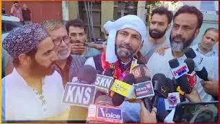 Omar Abdullah removes cap from his head.
