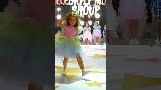 Little fashionista Milana, fashion show in a rainbow dress 
