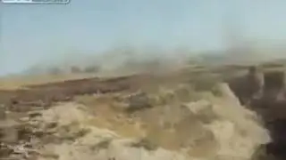 A-10 Thunderbolt II passes near British soldiers.