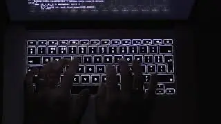 Typing a Macbook keyboard in the dark | Free stock video