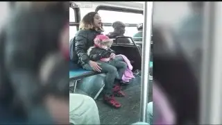 Mom caught on cam throwing baby to stranger on bus