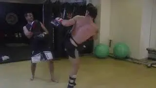 Coach Dan Isaac hitting the thai pads with kru Edgar Noordanus in 2013 at SFL fighters gym in Nasik