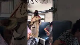 Baul singer with his ektara in Rampurhat-Bardhaman Passenger train