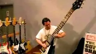 Guy plays on giant guitar