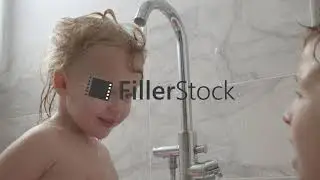 It is fun to play with elder brother in the bath